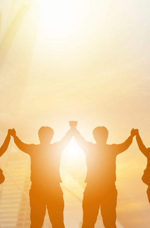 Silhouette of Business People Celebration Success Happiness Team at Sunset Evening Sky Background